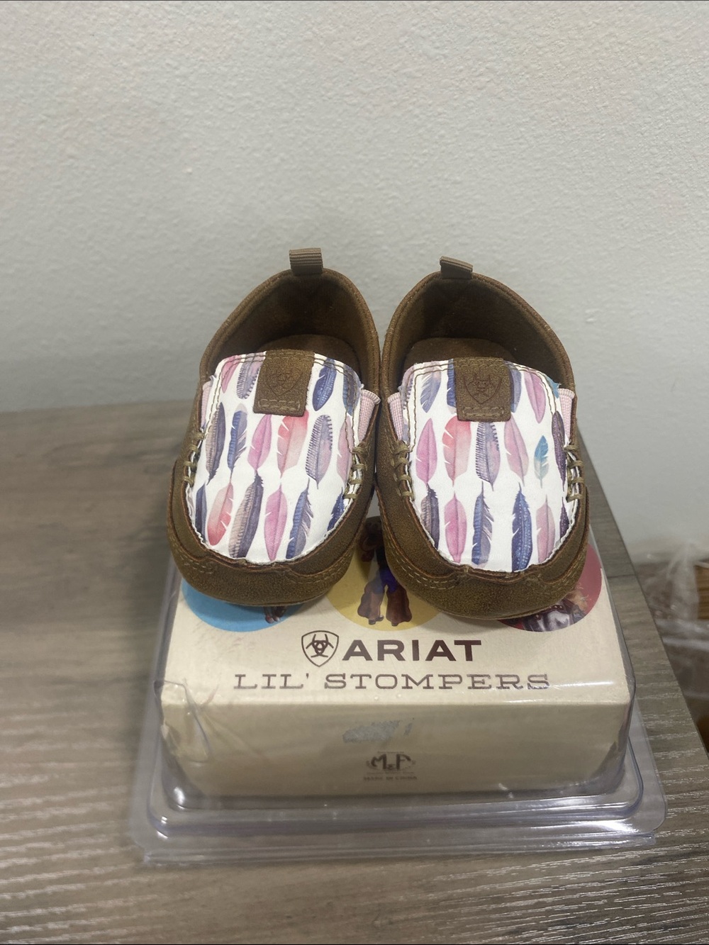 Ariat Kids Brown Moccasins with Pink Purple and Blue Feather Print